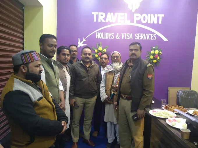 Travel Point team and guests at the office