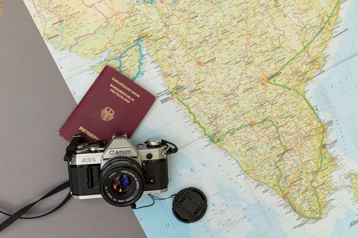 Passport and camera on a travel map